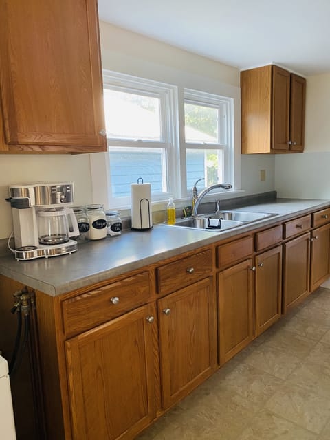 1/2 of Kitchen, where you can see our neighbor's chickens while doing dishes!
