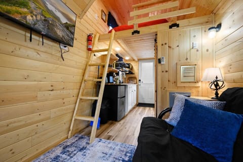 Climb up the ladder to relax in our cozy loft with queen sized bed :)