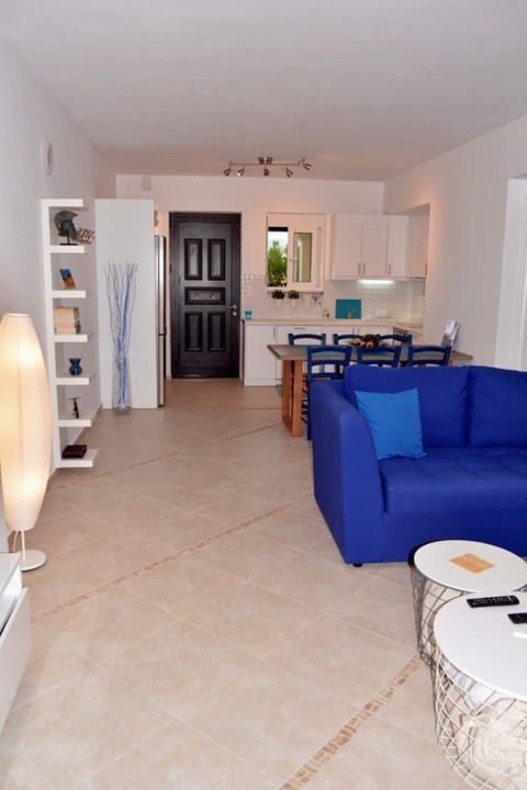 Open plan kitchen, dining, lounge TV area. air con, doors to terrace seating