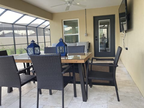 Outdoor dining  in the lanai seats  six comfortably