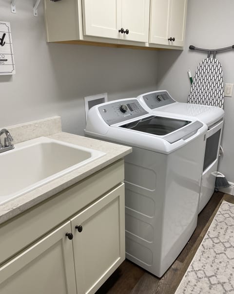 Washer and dryer off kitchen 