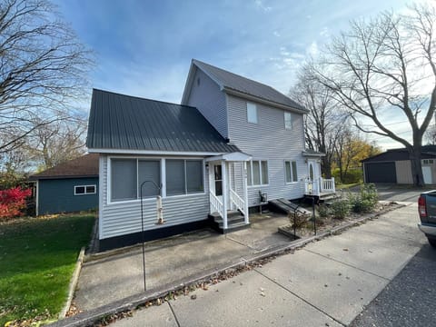 Exterior. Spring, Summer, Fall there is table & chairs, a swing and a grill. 