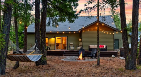 Backyard: Dining table, seating area, hot tub, wood fire pit