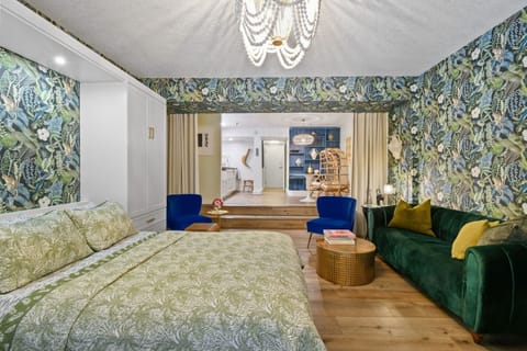 2 level Jungle Suite with Queen bed, Serta Mattress, living and dining areas