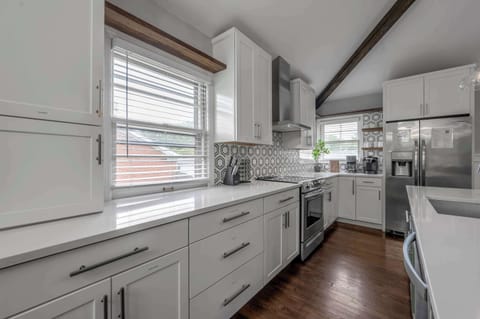 Experience the joy of cooking in a beautifully designed culinary space, complete with top-tier amenities and refined details, perfect for sharing flavorful creations and warm connections.