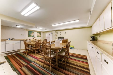 The kitchen and dining area have a dated floor, but allow the whole group to dine together.