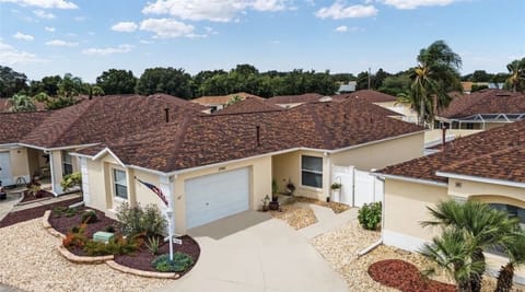 Beautifully landscaped with garage space for your car and golf cart
