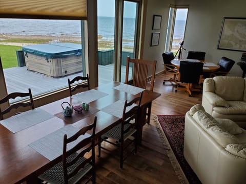 Great room features beautiful view of Huron. Multiple seating and eating areas.