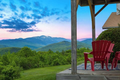 Serene mountain views from the porch — your peaceful New Hampshire escape overlooking lush green pines, blooming landscapes, and fresh spring air. 🌸🌿