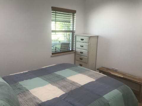 Private bedroom with queen size bed and dresser