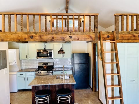 Full kitchen with washer and dryer