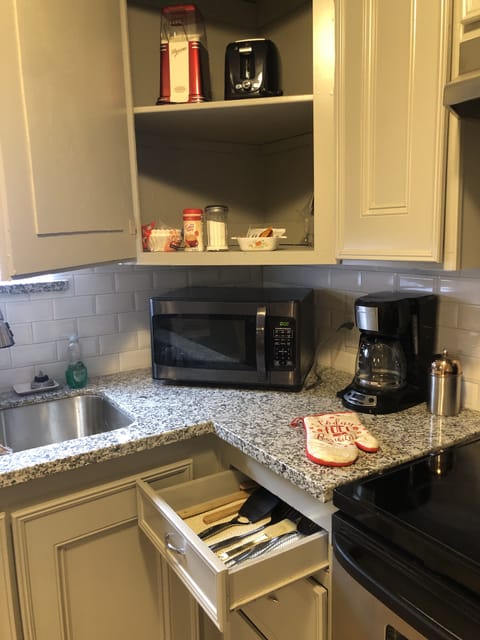 Microwave and coffee pot.  Coffee, creamer, sugar, tea and cocoa provided