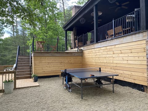 Outdoor Space - Blue Haven Lake House has a wonderful outdoor space. You can participate in ping pong or enjoy the nice Alabama weather on the plentiful seating!
