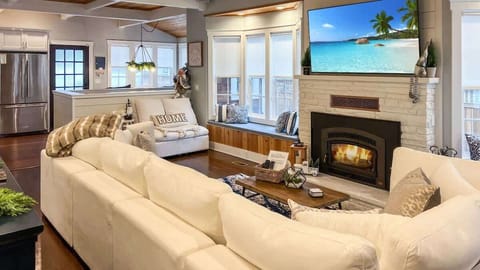 Bright main floor living room with flat screen tv 