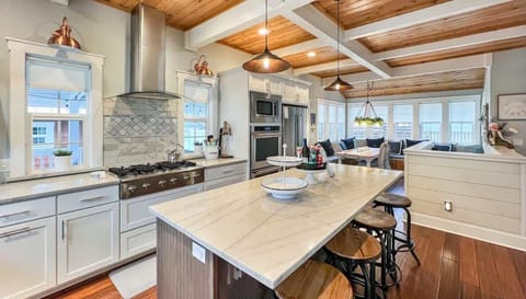 Chef-ready kitchen with a large island, gas range, and space to gather.