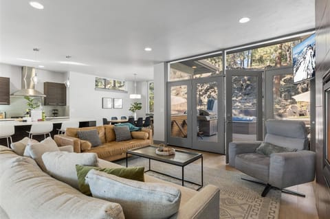 Living Room with doors to patio and backyard views