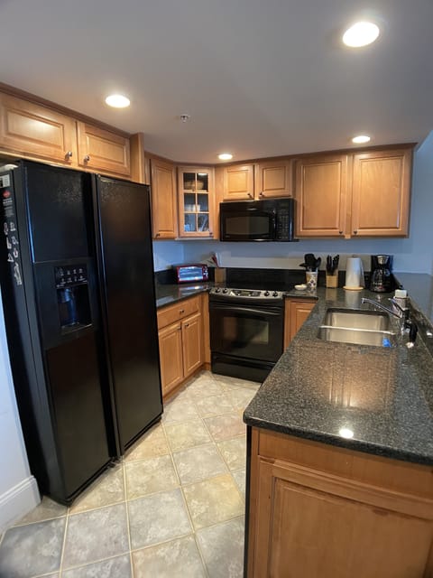Well equipped kitchen complete with coffee maker, toaster oven, microwave
