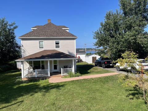 Front of house, street view, Port Hood Island in the background