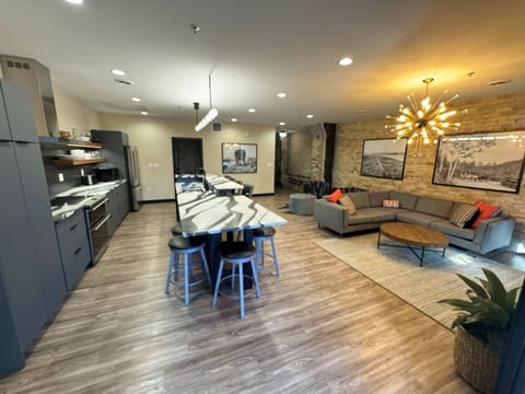 Open concept kitchen, dining, and living room space