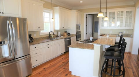 Kitchen with gas stove and seperate pantry.