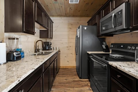 Each kitchen is fully stocked with dishes, pots, pans, stainless steel appliances. Both a drip coffee maker and Keurig are at your service! A charcoal BBQ grill is available out back of each unit. High chairs and children's dinnerware are provided.