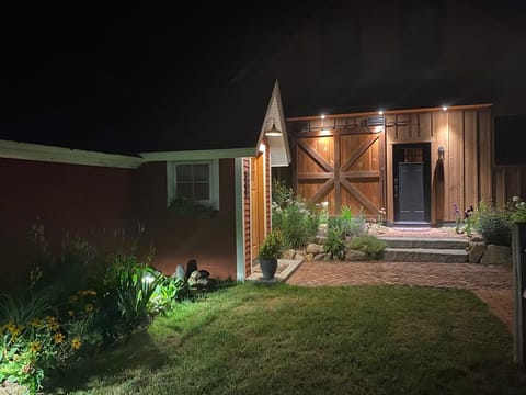 Night time picture, lighted paths & entrance