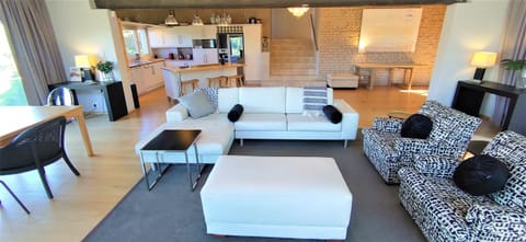 Standing in front of the TV, looking back into the open plan living area