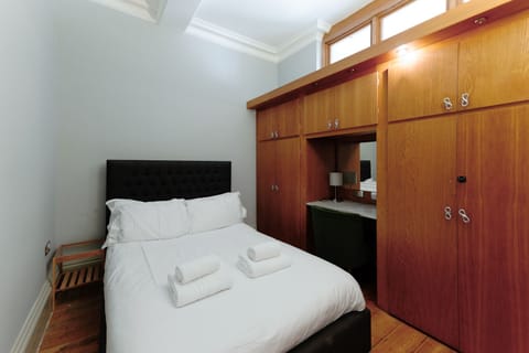 Second bedroom featuring a built-in wardrobe for added storage.