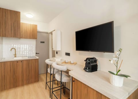 Cozy kitchenette stocked with utensils and appliances for a stress-free stay.