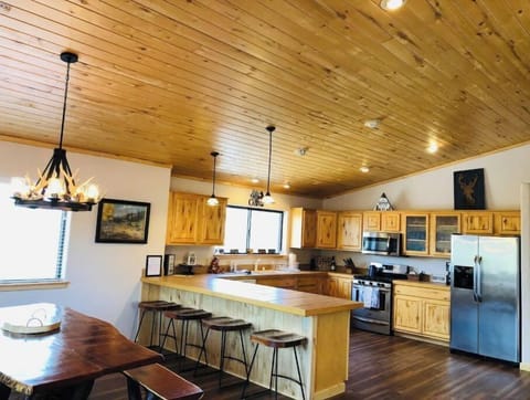 Large kitchen is well stocked with pots, pans, cooking utensils, etc.