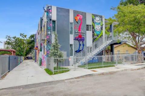 To the left, path to the parking lot. Staircase to 2nd floor units to the right.