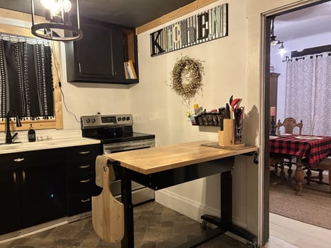 Full kitchen with plenty of baking utensils and spices.