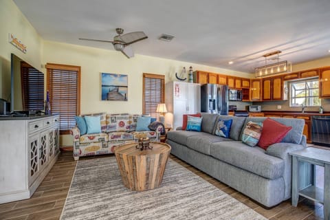 Unwind in the cozy living room, offering respite after an exhilarating day of sun-soaked adventures.