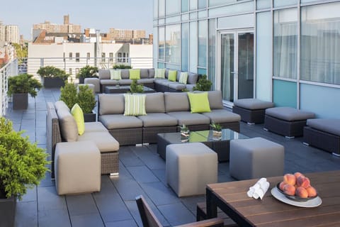 Unwind on plush outdoor lounges with fresh-air city energy.