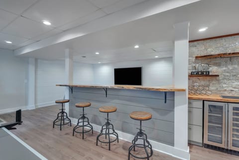 Bar countertop w stools for watching the TV, ping pong match, or enjoying drinks