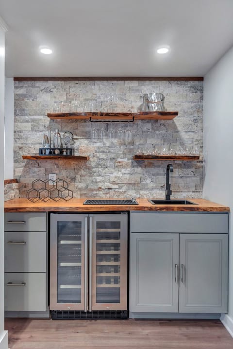 Fully equipped wet bar made w local live edge wood and w dual-zone refrigerator