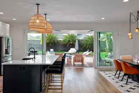 Open kitchen and dining area with pool views