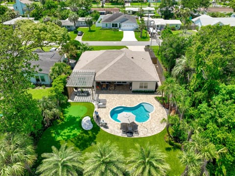 Bird's eye view of the spacious yard, putting green and sparkling pool