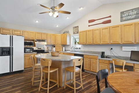 Island, refrigerator, microwave, toaster oven, range/oven, sink, dishwaser, desk