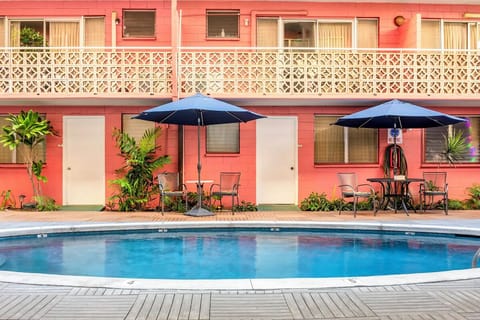 Linger poolside with easy access to rooms and shaded seating.