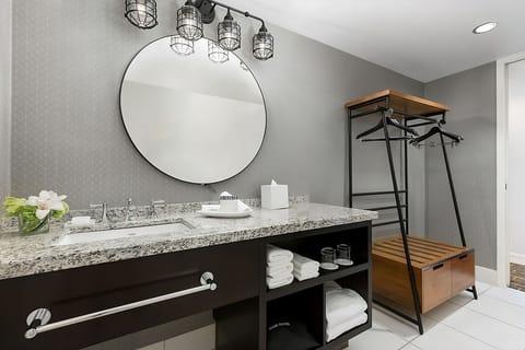 Get ready effortlessly at the wide vanity with ample storage.