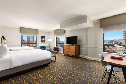 Spread out comfortably with extra space, desk, and city light.