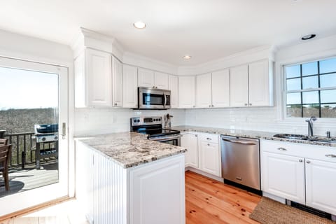 Granite and stainless modern kitchen is fully equipped for your cooking needs. 