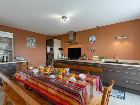 Cabinetry, Property, Table, Countertop, Wood, Kitchen & Dining Room Table, Chair, Interior Design, Lighting, Orange