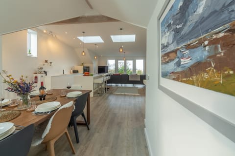 Seastiles, Salthouse: Dining area with well-equipped kitchen beyond