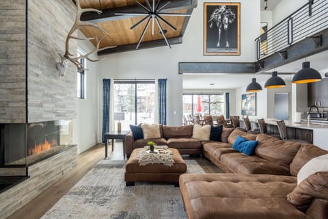 The open living room flows into the dining room and kitchen