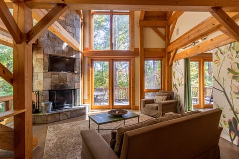 Main level living room with wood burning fireplace.