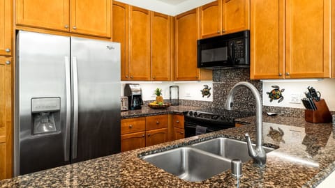 Kitchen with granite countertops and all the appliances you'll need to prepare meals