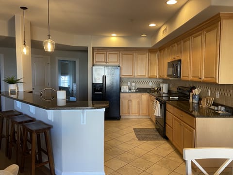 Kitchen from dining room, seating for 3 at bar