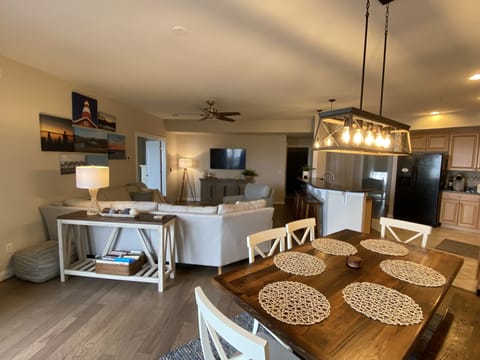 Dining room/living room with smart tv equipped with Apple TV and Chromecast